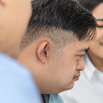 handicapped man with care staff